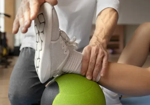 patient-doing-physical-rehabilitation-helped-by-therapists